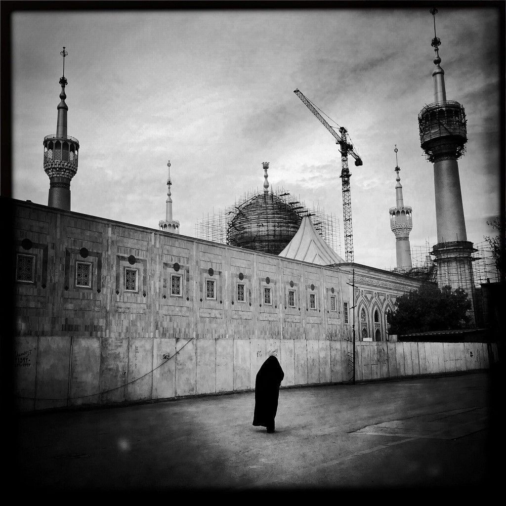 Lone woman walking outside the Imam Khomeini Mausoleum