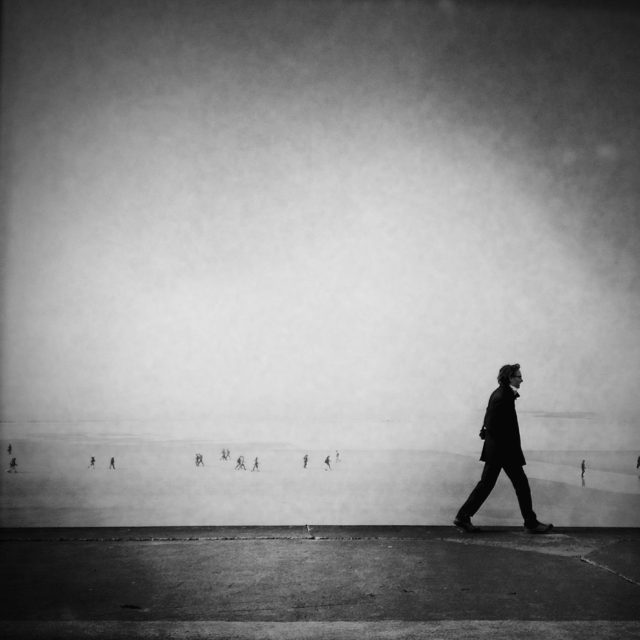 A man on the way, Saint-Malo, Brittany. By the sea, streetphotography is a topic not broached enough. Life by the sea is not only landscapes, there are also people who are as interesting as in the big cities like New York or Paris.